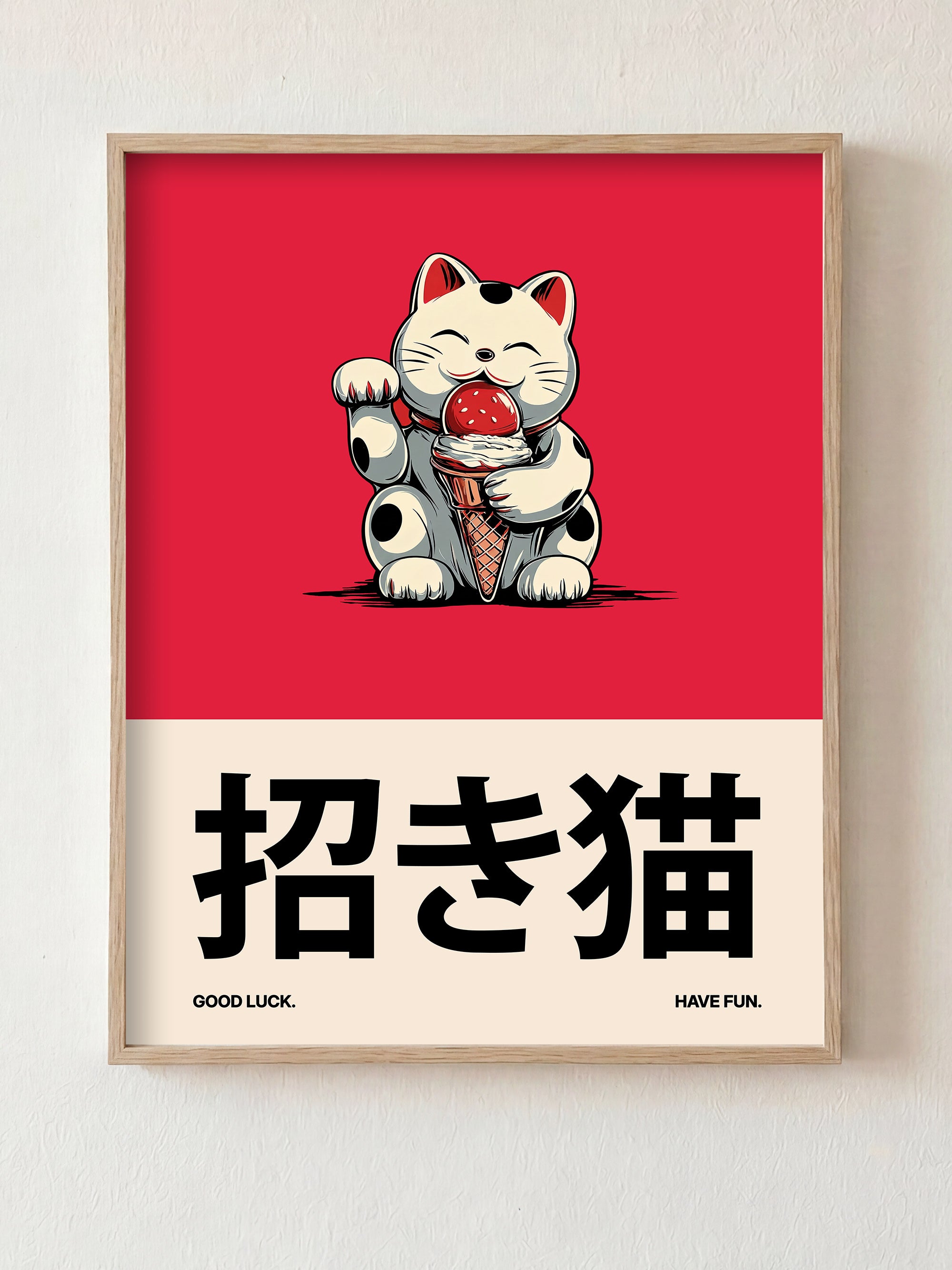 Framed artwork of a Maneki Neko cat holding an ice cream cone on a red background with Japanese text and English phrases.