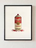 Framed artwork of a can labeled 'Graffiti Tomato Spray' on a white wall.