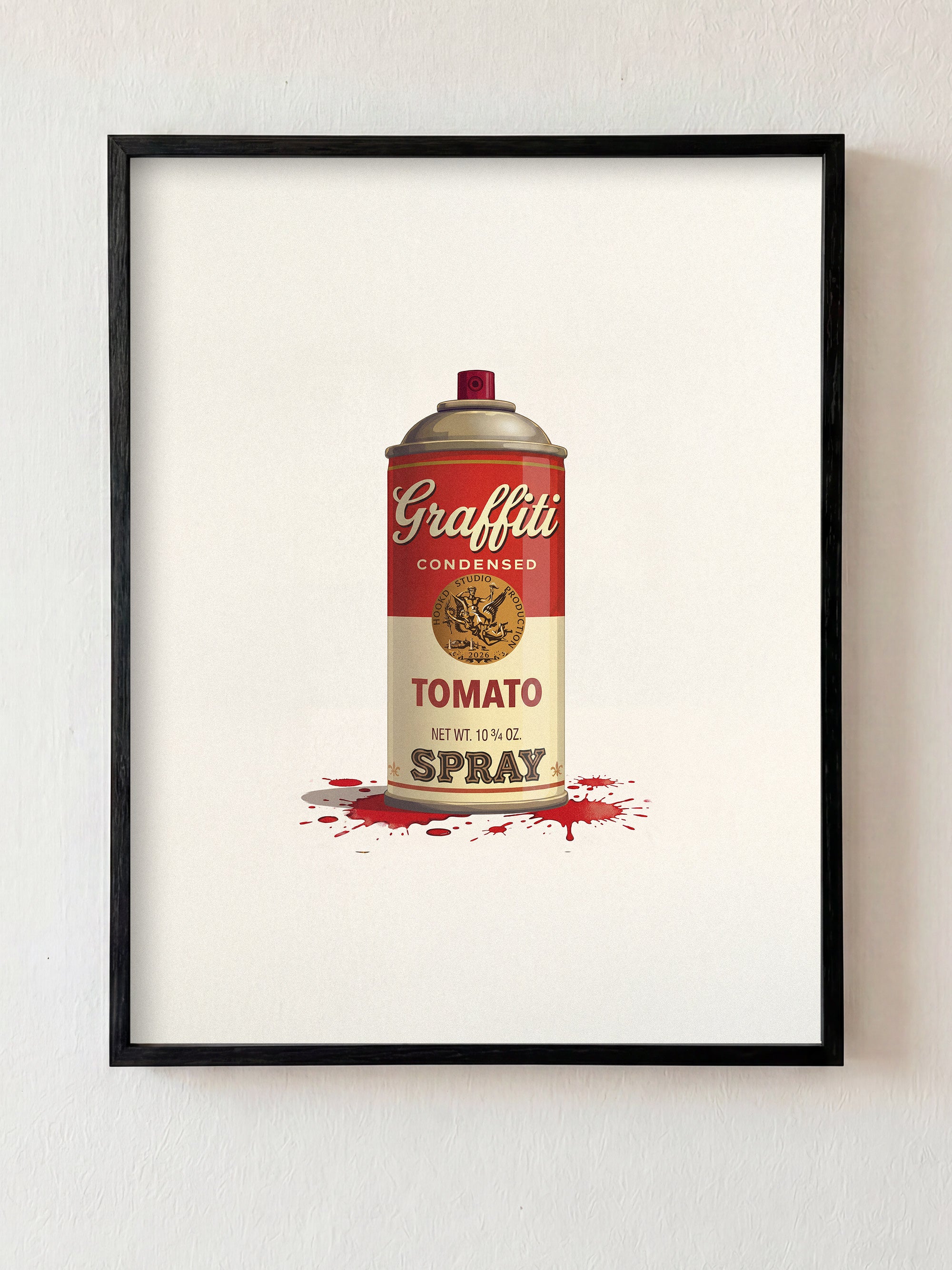 Framed artwork of a can labeled 'Graffiti Tomato Spray' on a white wall.