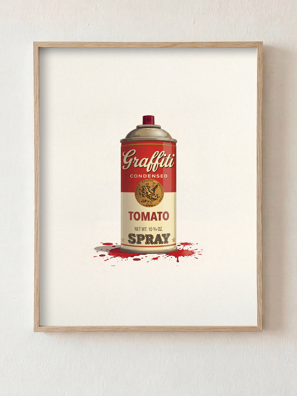 Framed artwork of a can labeled 'Graffiti Tomato Spray' on a white wall.